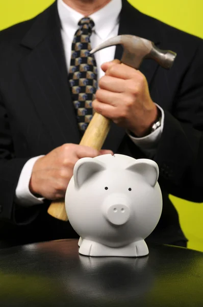 Businessman with Hammer in Front of Piggy Bank — Stock Photo, Image