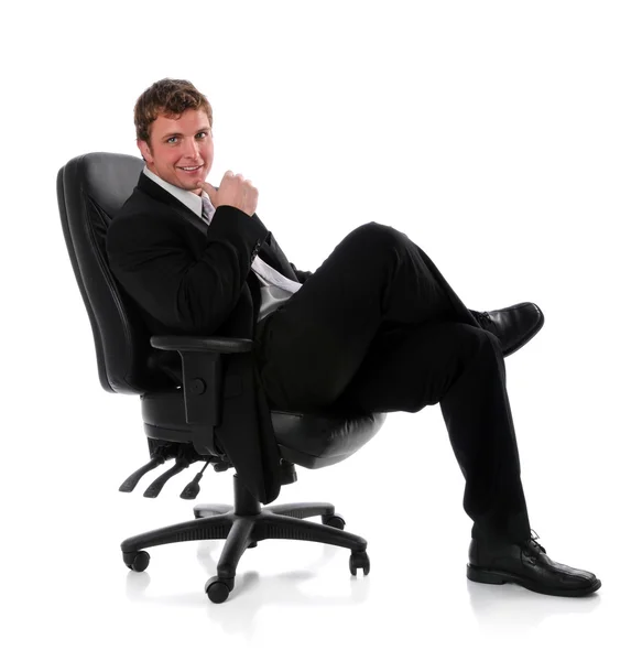 Üzletember ül a széken — Stock Fotó