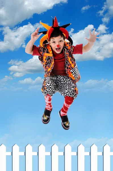 Clhild clown Jumping Fence — Stock Photo, Image