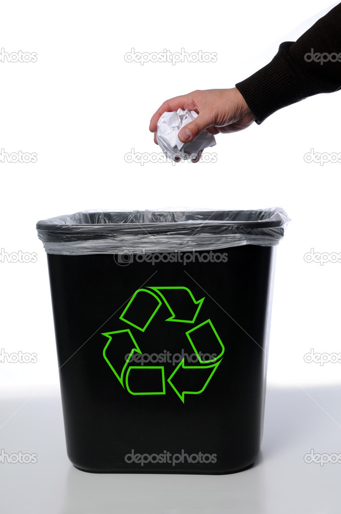 Hand and paper with recycle trash can