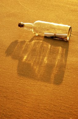 Message in a Bottle at Sunset clipart