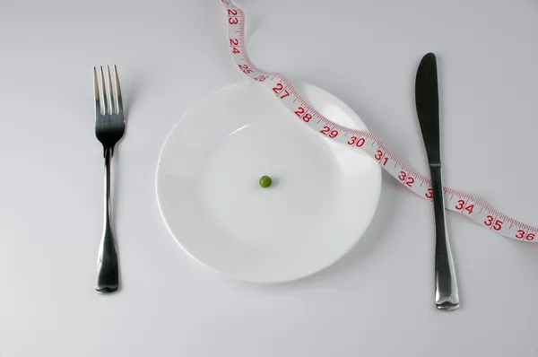 Pea and tape meassure diet — Stock Photo, Image