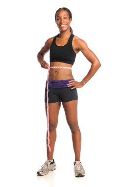 Bel üzerinde ölçüm bandı kullanan kadın