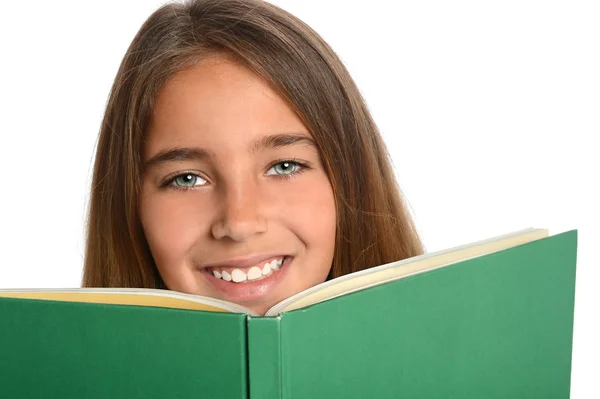 Menina jovem por trás do livro — Fotografia de Stock