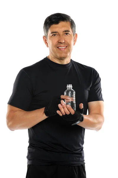 Hispanik erkek holding şişelenmiş su — Stok fotoğraf