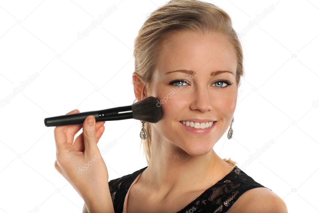 Young woman Using Makeup Brush