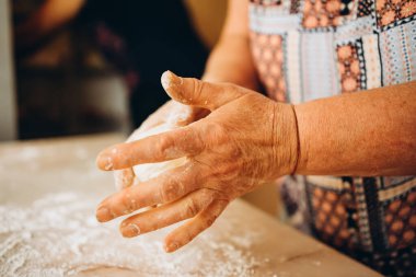 Making dough by male hands at bakery. Food concept. High quality photo