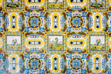 Traditional decorative tile with motifs from Castilla-La Mancha and Don Quixote, in Spain, in the city of Lietor. Made in Manises.