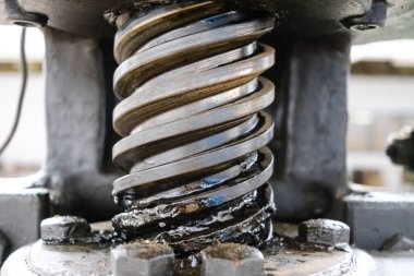 Industrial manual spindle press, detail of the greased screw.