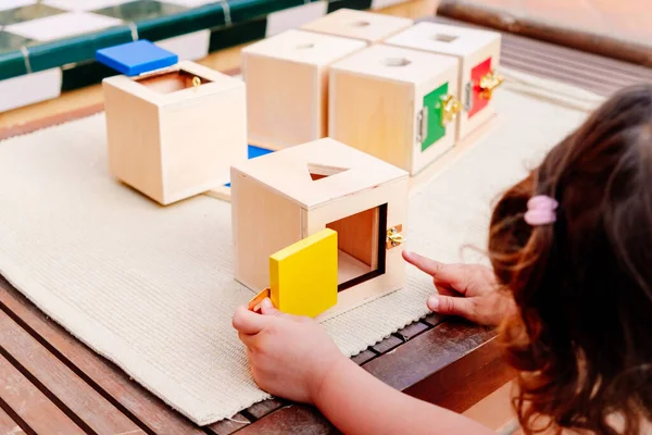 Girl Learns Using Her Hands Play Wooden Boxes Locks Montessori — Stockfoto