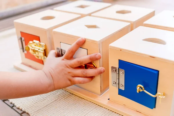 Girl Learns Using Her Hands Play Wooden Boxes Locks Montessori — Stockfoto