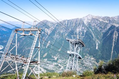 Thick pillars and posts support the cables of a cable car in a mountainous area, mountain infrastructure.