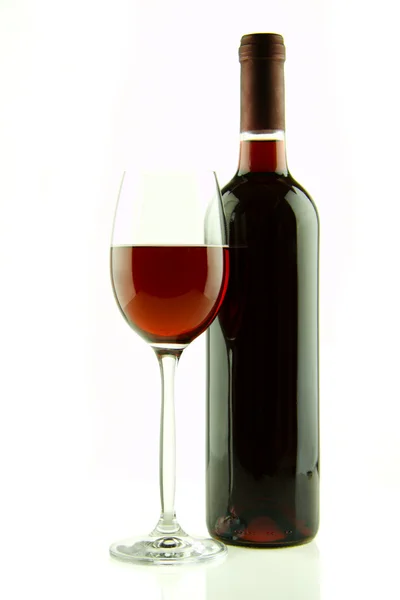 Bottle and glass of red wine isolated — Stock Photo, Image