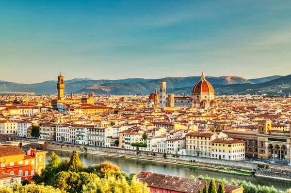 Florence Aerial View at Sunrise over Ponte Vecchio, Italy over Palazzo Vecchio and Cathedral of Santa Maria del Fiore with Duomo, Italy