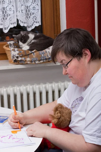 Mentally disabled woman is painting — Stok fotoğraf