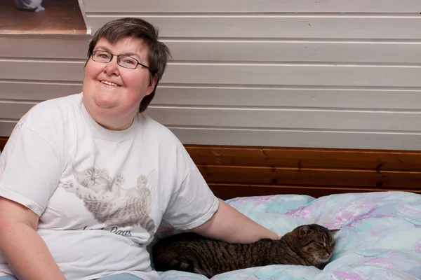 Mentaly disabled woman with cat — Stock Photo, Image