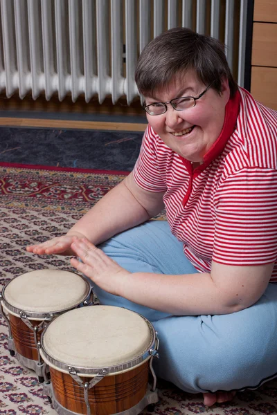Mentaly disabled woman with drums — Stock Photo, Image