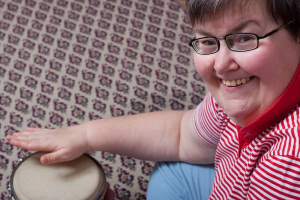 Mentaly disabled woman with drums — Stock Photo, Image