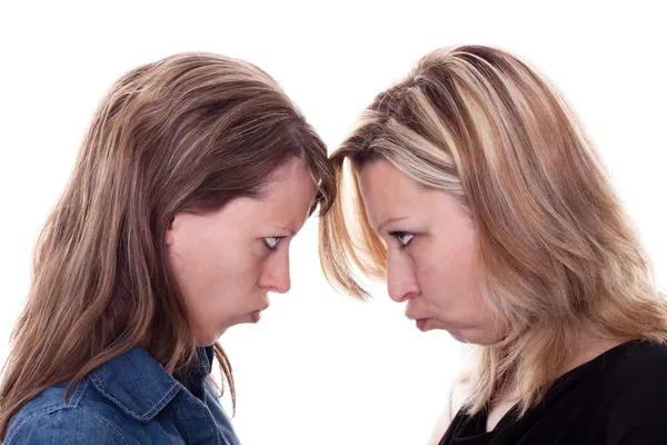 Two angry woman faces each other — Stock Photo, Image