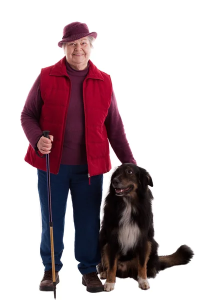 Active Senior Woman with walking stick and dog — Photo