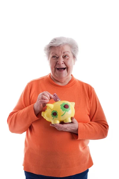 Senior holding a piggybank — Stock Photo, Image