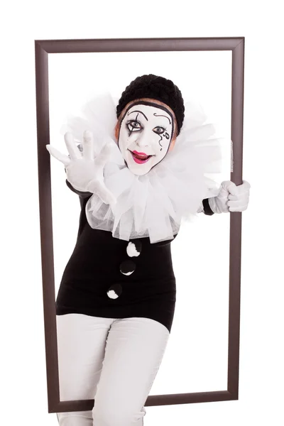 Female pierrot in a frame reaching hand to viewer — Foto Stock