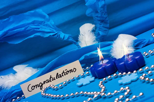 Background in blue, with festive candles —  Fotos de Stock