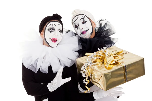 A couple clowns with a golden present — Stockfoto