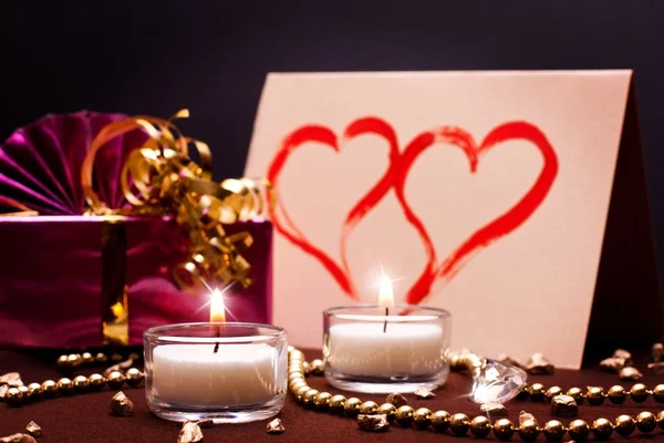 Luxurious background with present and candles — Stock Photo, Image