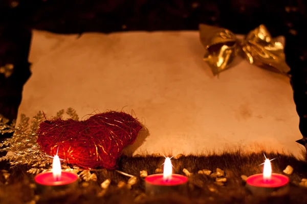 Parchment with candles, gold nuggets and heart — Stock Photo, Image