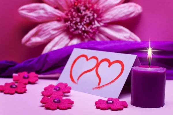 Romantic pink background with candle — Stock Photo, Image