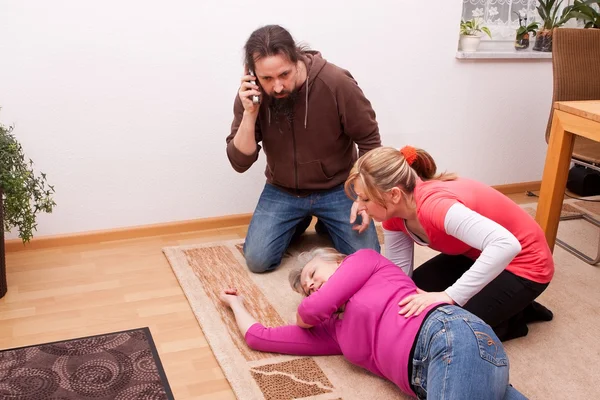 Senior is unconscious, childs calling rescue service — Stock Photo, Image