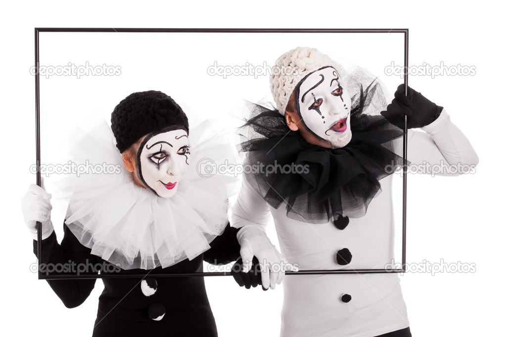Two clowns in a frame looking in the same direction