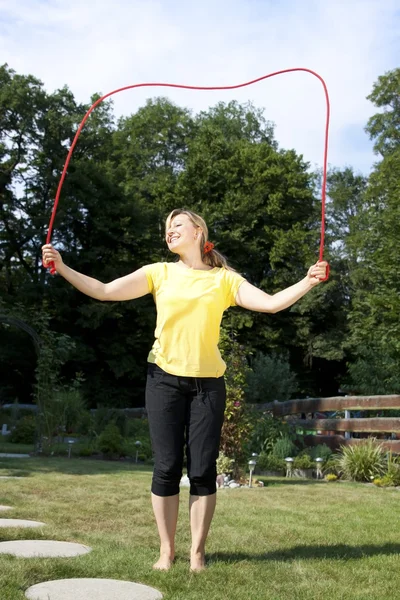 Woman has fun with jumping rope — Photo