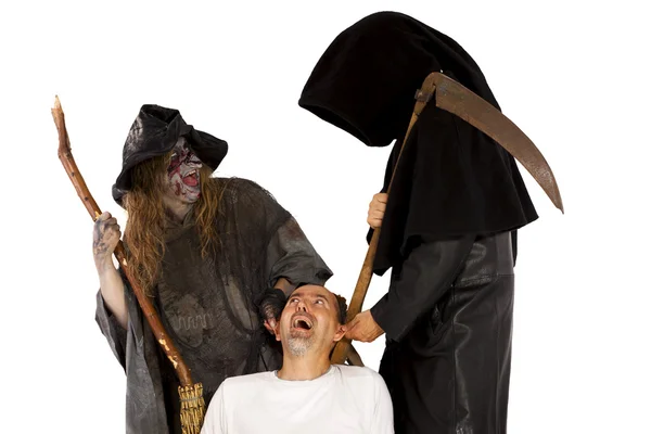 Death and Witch tug at victim — Foto Stock