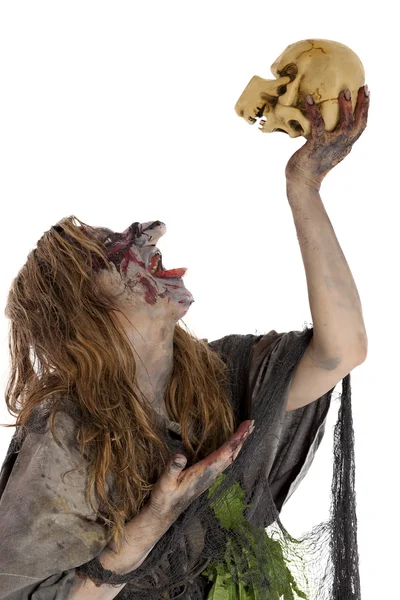 Witch raises skull in the air — Stock Photo, Image