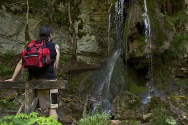 Hiker at a waterfall