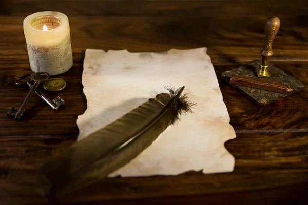 Empty parchment document with feather — Stockfoto