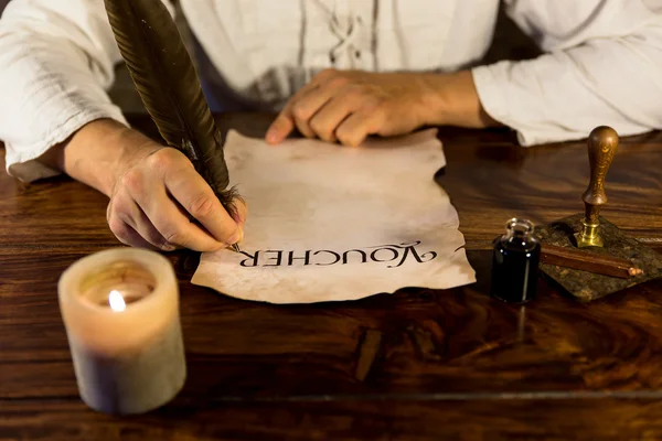 Man inscribed parchment — стоковое фото