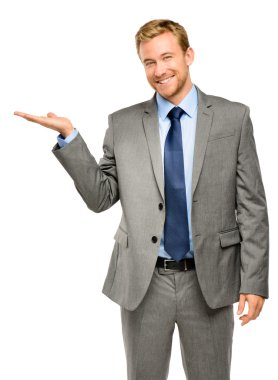 Happy young businessman showing empty copyspace on white backgro clipart