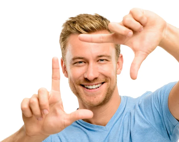 Hombre feliz enmarcando fotografía —  Fotos de Stock