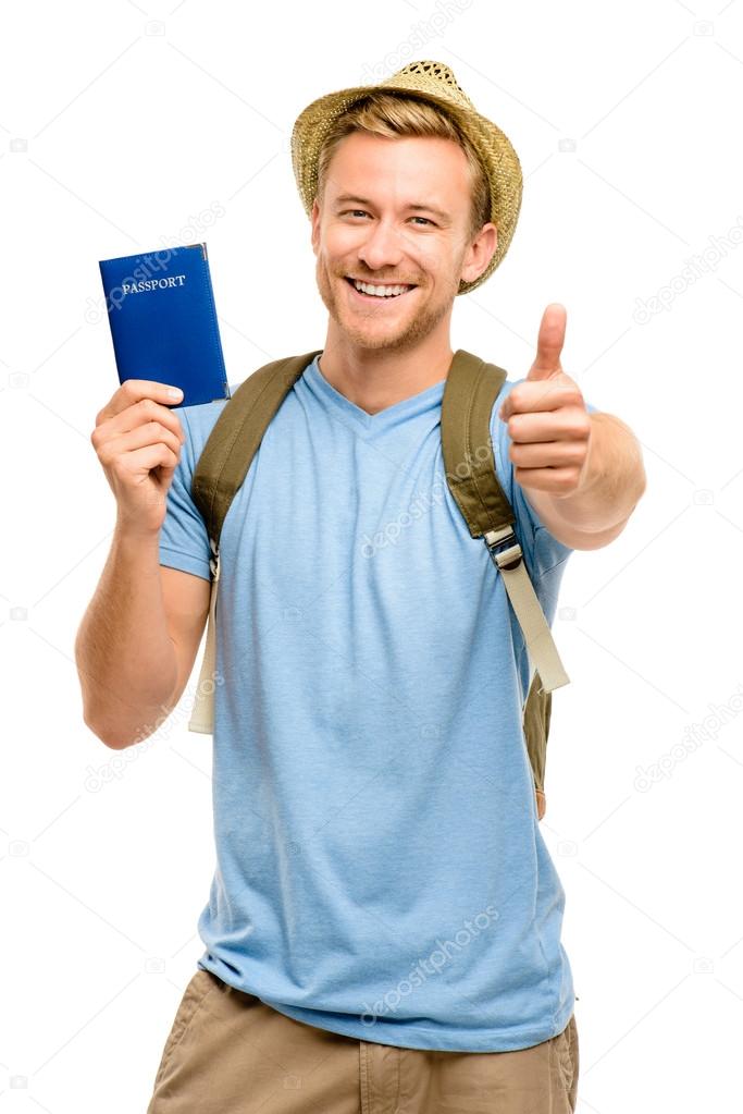 Happy young tourist man holding passport thumbs up white backgro
