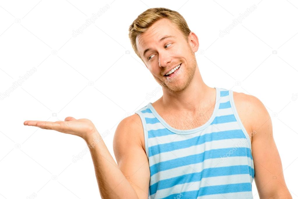 Happy young man showing empty copyspace on white background