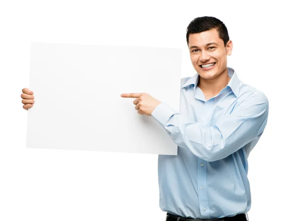 Asiático hombre de negocios apuntando a blanco cartel fondo blanco — Foto de Stock