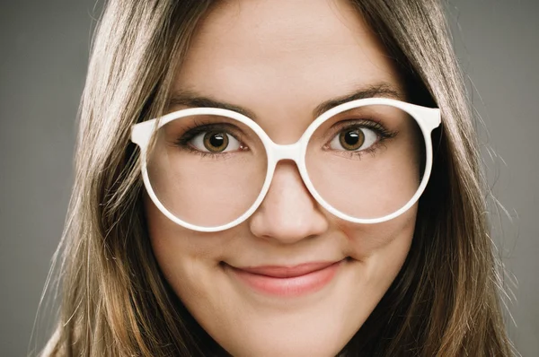 Retro Geek Girl wearing glasses grainy vintage portrait — Stock Photo, Image