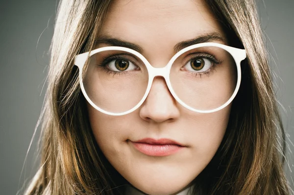 Retro Geek Girl wearing glasses grainy vintage portrait — Stock Photo, Image