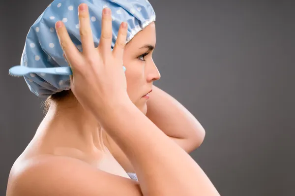 Geeky teenager in the bathroom — Stock Photo, Image