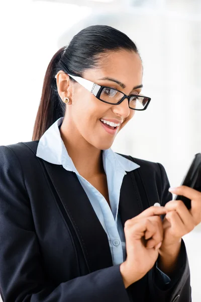 Closeup portrait of beuatiful indian businesswoman sending text — Stock Photo, Image