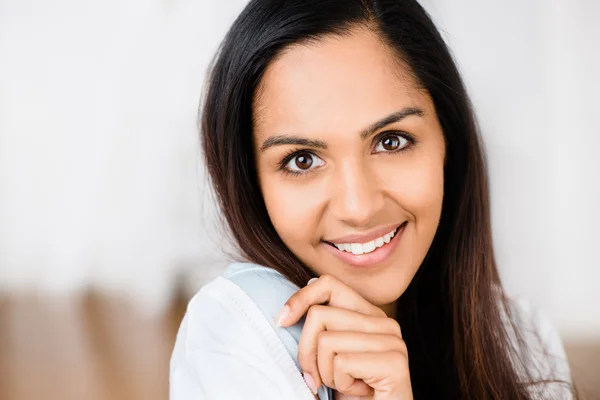 Closeup portrait of cute Indian teenage girl smiling at home Stock Image