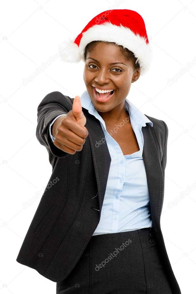 Cute African American businesswoman thumbs up sign wearing Christmas hat